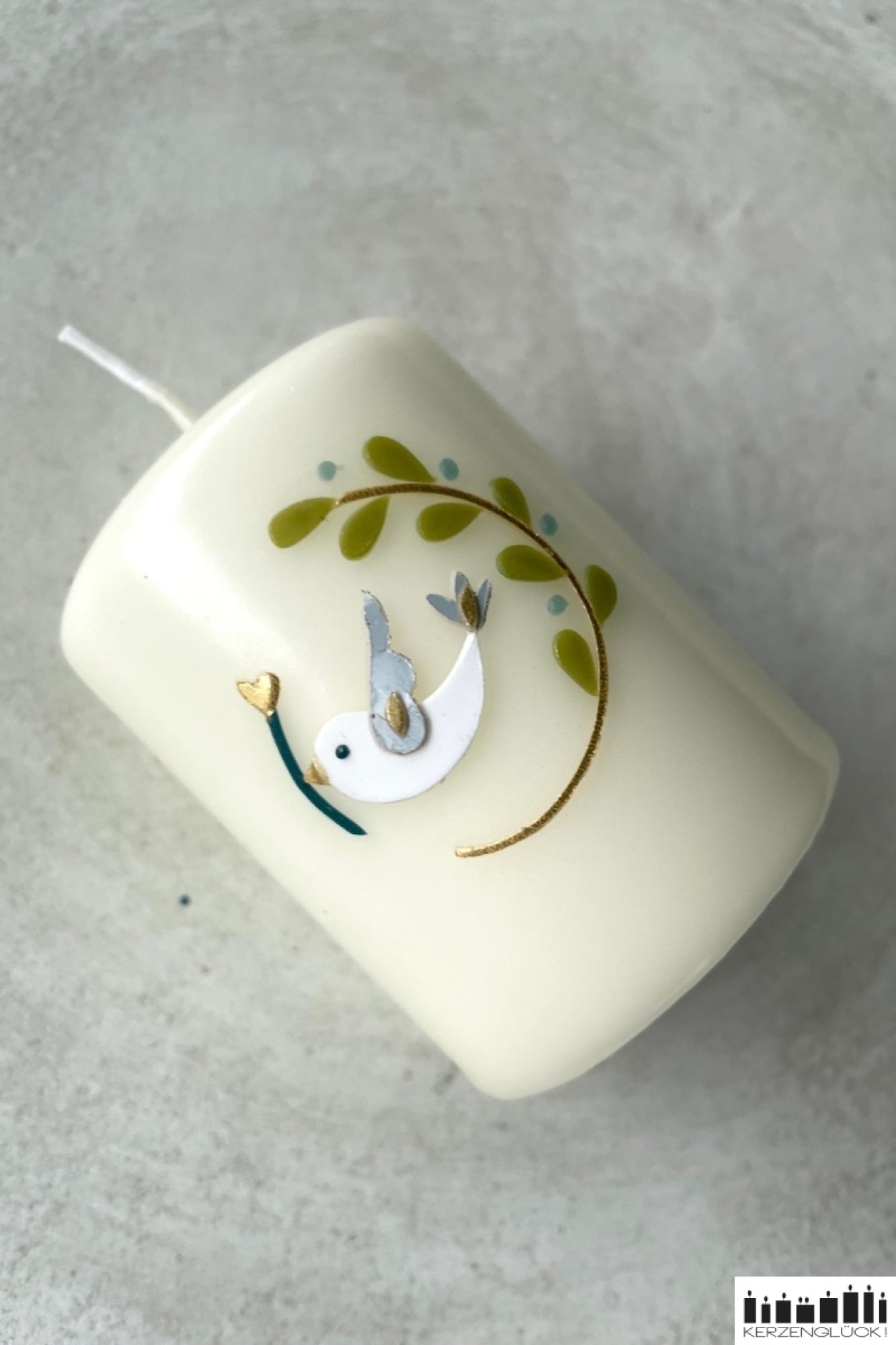 Gastgeschenkkerze „Kranz mit Symbolen"